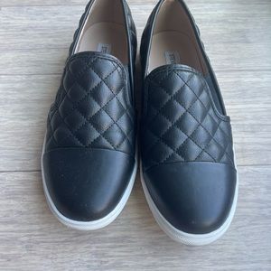 Steve Madden Black Slip on Sneaker with quilted leather. Size: 7